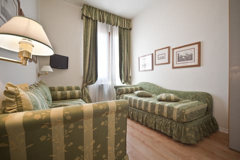 Family Quadruple Room | Premium bedding, minibar, in-room safe, desk