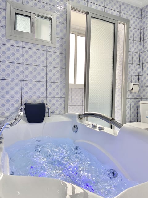 Premium Suite, 1 King Bed | Bathroom | Hair dryer, bathrobes, bidet, towels