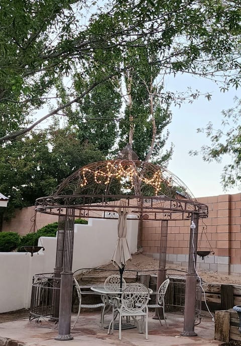 Gazebo with outdoor dining space on flagstone