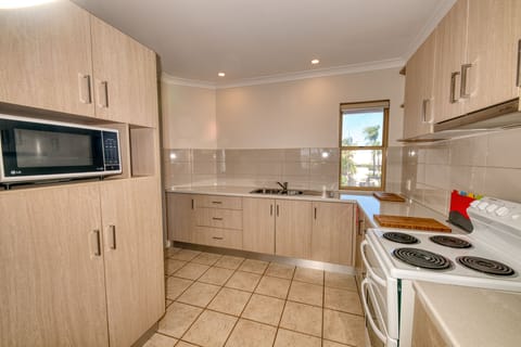 Panoramic Apartment, Beach View | Private kitchen | Full-size fridge, microwave, oven, stovetop