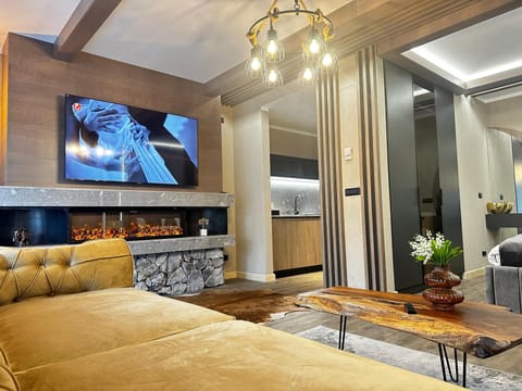 Deluxe Chalet | Living area | 120-cm Smart TV with digital channels, fireplace