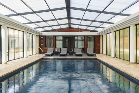 Indoor pool, open 10:00 AM to 8:00 PM, pool umbrellas, sun loungers