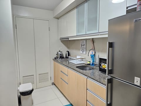 Comfort Condo | Private kitchen | Fridge, microwave, stovetop, electric kettle