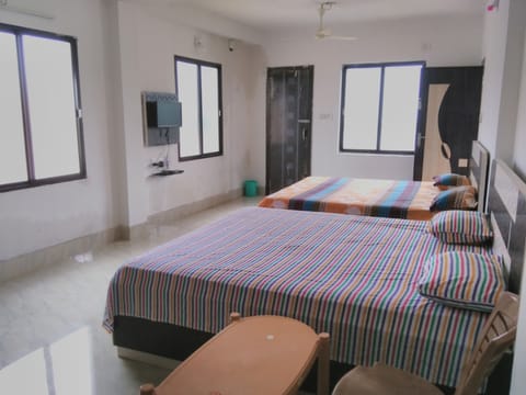 Deluxe Quadruple Room, City View | Soundproofing, free WiFi, bed sheets