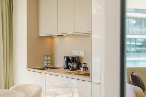 The fully equipped kitchenette includes everything you need for a home-cooked meal.