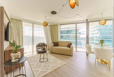 Relax in the stylish living room with a comfortable sofa and modern decor.