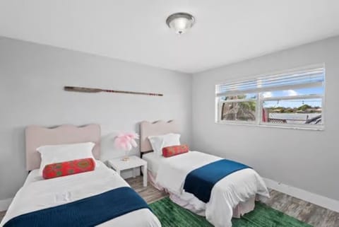 Rest easy in this inviting bedroom with two single beds