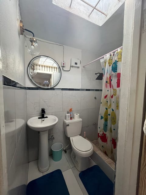 Comfort Apartment | Bathroom | Shower, rainfall showerhead, towels, soap