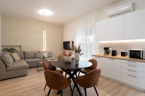 Superior Apartment (Athens Hills A2) | Living area | 50-inch Smart TV with cable channels