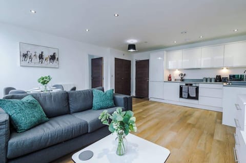 The open-plan living room, dining area and kitchen benefit from a comfortable sofa and 40-inch SMART TV.