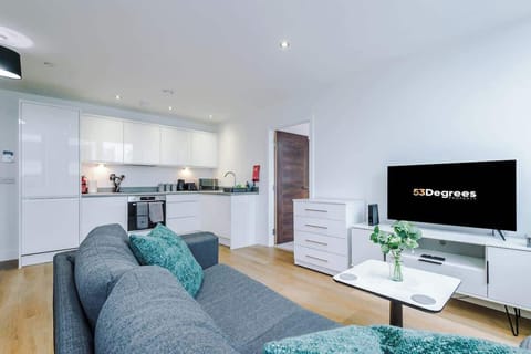 The open-plan living room, dining area and kitchen benefit from a comfortable sofa and 40-inch SMART TV.