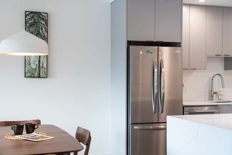 Luxury Condo | Private kitchen | Full-size fridge, microwave, oven, dishwasher