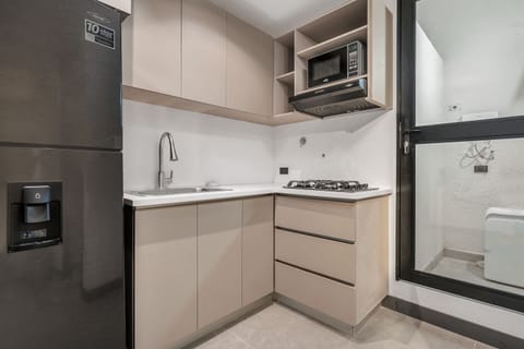 Apartment (203) | Private kitchen | Full-size fridge, microwave, oven, coffee/tea maker