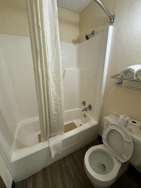 Basic Room, 2 Queen Beds, Non Smoking | Bathroom | Combined shower/tub, rainfall showerhead, towels