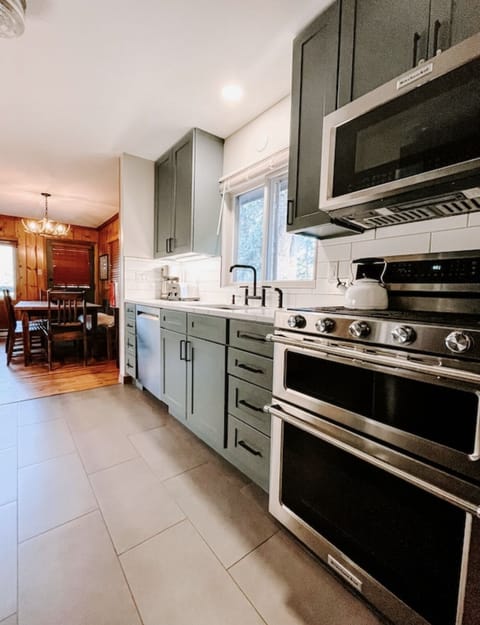 Modern kitchen with KitchenAid appliances.