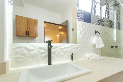 Sunset Serenade - Standard Room | Bathroom | Shower, rainfall showerhead, towels, soap