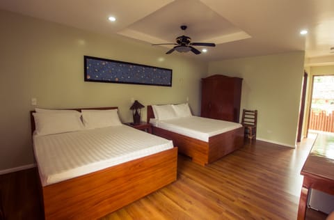 Deluxe Room, 2 Queen Beds, Partial Ocean View | In-room safe, desk, soundproofing, iron/ironing board