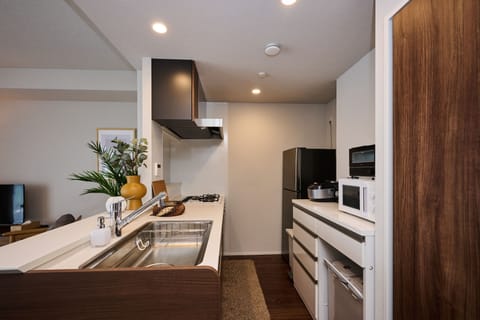 Design Apartment | Private kitchen | Full-size fridge, microwave, stovetop, dishwasher