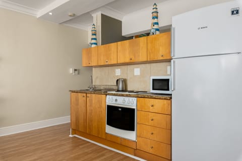 Apartment | Private kitchen | Full-size fridge, microwave, oven, stovetop