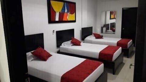 Triple Room | Minibar, blackout drapes, free rollaway beds, free WiFi