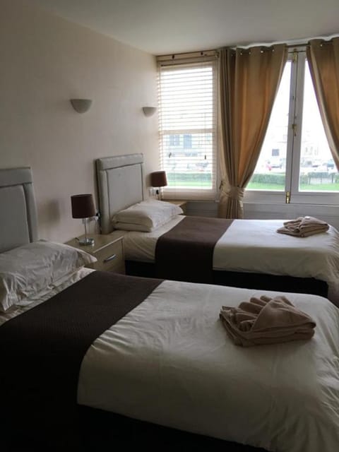 Twin Room | Blackout drapes, iron/ironing board, free WiFi, bed sheets