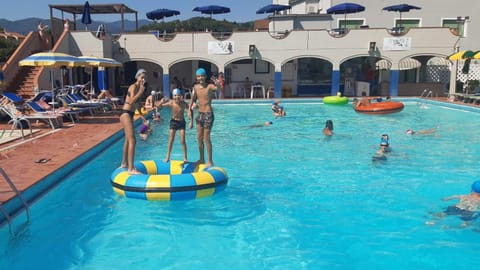 Seasonal outdoor pool, pool umbrellas, sun loungers