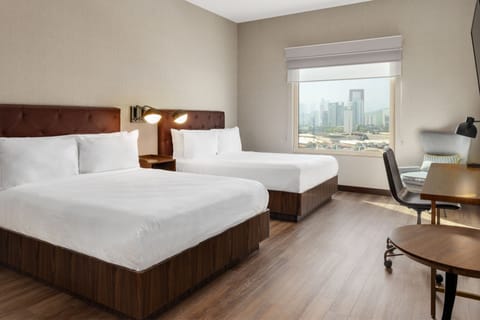 Premium Room, 2 Queen Beds, Non Smoking, City View | In-room safe, desk, laptop workspace, soundproofing