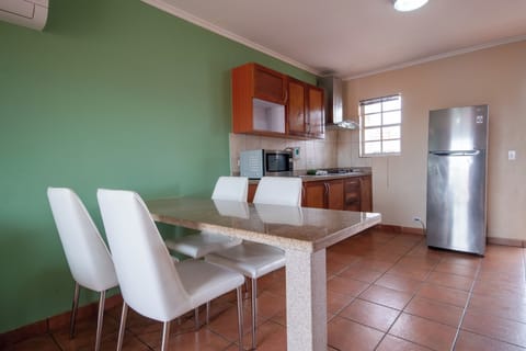 Comfort Apartment, 2 Bedrooms | Private kitchen | Full-size fridge, microwave, stovetop, coffee/tea maker