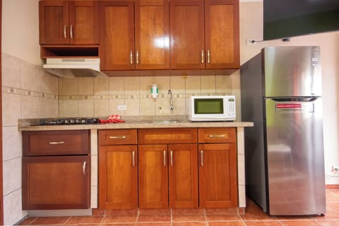 Comfort Room, 1 Bedroom | Private kitchen | Full-size fridge, microwave, stovetop, coffee/tea maker