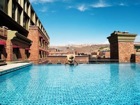 Outdoor pool, open 7:00 AM to 10:00 PM, sun loungers