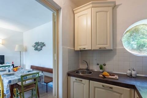 Family Apartment, 2 Bedrooms, Sea Facing (La Casina Del Pescatore On the Beach) | Private kitchen | Fridge, oven, stovetop, coffee/tea maker