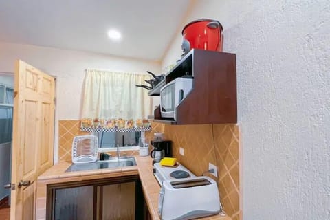 Standard Villa | Private kitchen | Fridge, microwave, stovetop, cookware/dishes/utensils