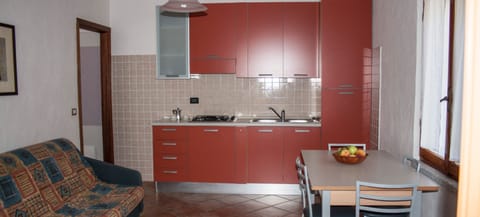 Apartment, 1 Bedroom | Private kitchen | Full-size fridge, stovetop, cookware/dishes/utensils, freezer