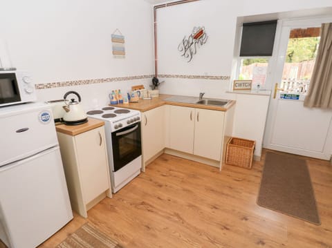 Fridge, electric kettle, toaster, cookware/dishes/utensils