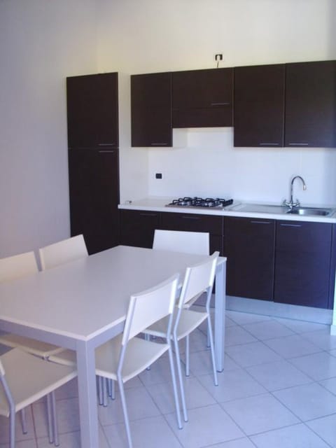 Apartment, 1 Bedroom | Private kitchenette | Full-size fridge, stovetop, coffee/tea maker, cookware/dishes/utensils