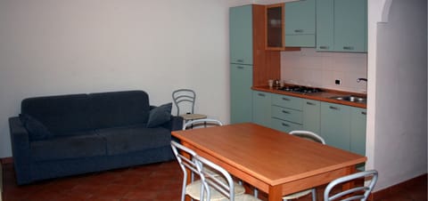 Apartment, 1 Bedroom | Private kitchen | Full-size fridge, stovetop, coffee/tea maker, cookware/dishes/utensils