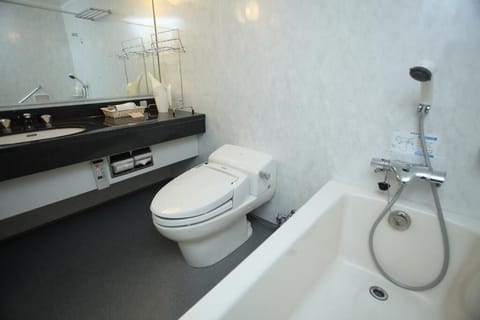 Basic Twin Room | Bathroom | Combined shower/tub, slippers, electronic bidet