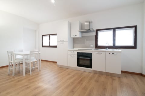 Grand Apartment, 3 Bedrooms, City View | Private kitchen | Full-size fridge, oven, stovetop, highchair