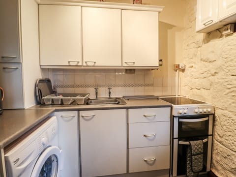 Fridge, electric kettle, toaster, cookware/dishes/utensils