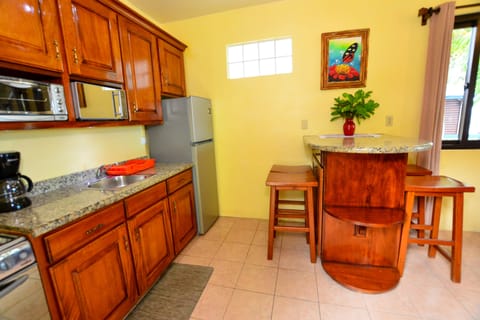 Superior Bungalow, 2 Bedrooms, Balcony, Beachfront | Private kitchen | Fridge, coffee/tea maker, toaster, dining tables