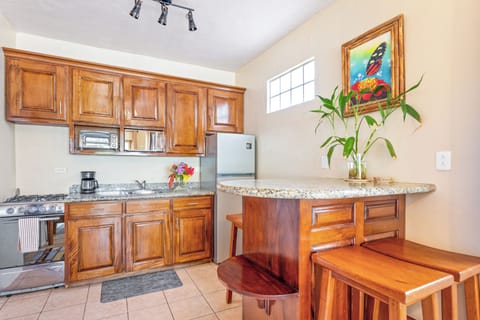 Superior Bungalow, 2 Bedrooms, Balcony, Beachfront | Private kitchen | Coffee/tea maker, toaster, dining tables