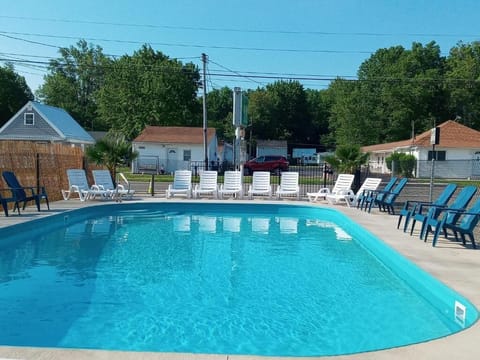 Seasonal outdoor pool, open 8:00 AM to 8:00 PM, sun loungers