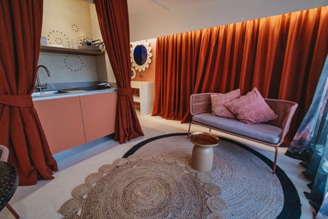 Luxury Studio | Living area | Flat-screen TV