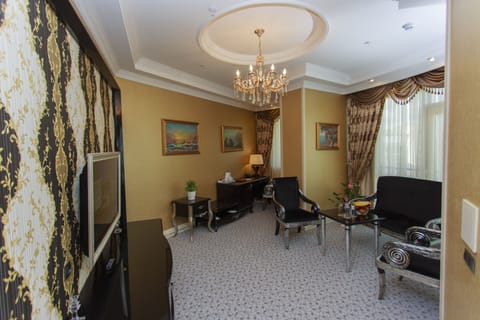 Suite, 1 Bedroom | Living area | LED TV