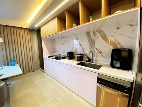 Luxury Apartment | Private kitchen | Microwave, oven, cookware/dishes/utensils