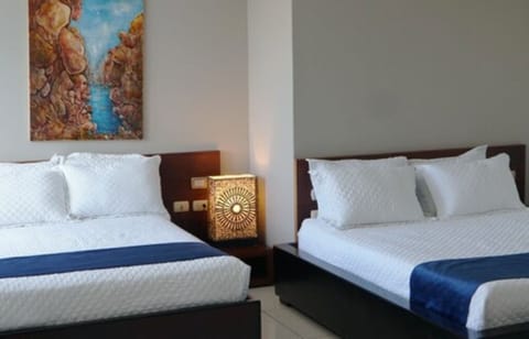 Deluxe Room, 2 Double Beds | Premium bedding, minibar, individually furnished, bed sheets