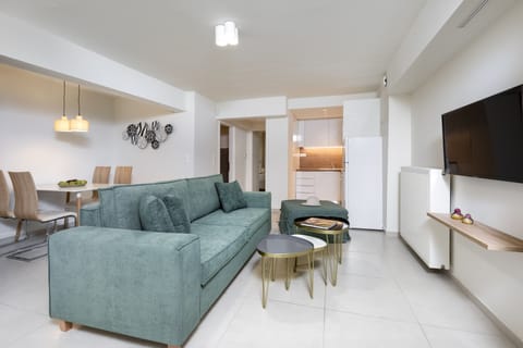 Comfort Apartment, 1 Bedroom, Garden View | Living area | 40-inch Smart TV with digital channels, fireplace