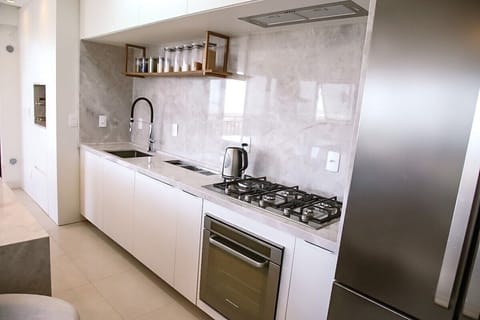 Deluxe Apartment, Pool Access, Sea Facing | Private kitchen | Fridge, microwave, cookware/dishes/utensils, dining tables