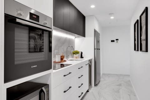 Apartment | Private kitchen | Full-size fridge, microwave, oven, stovetop