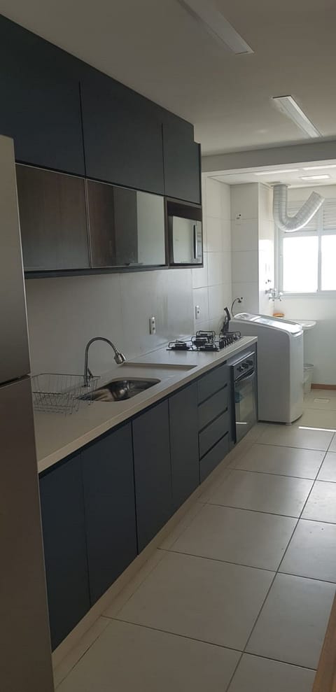 Deluxe Apartment, Pool Access, Beach View | Private kitchen | Cookware/dishes/utensils, dining tables